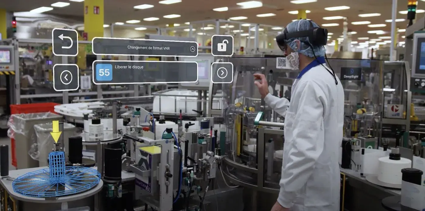 Technician using augmented reality glasses on a factory floor